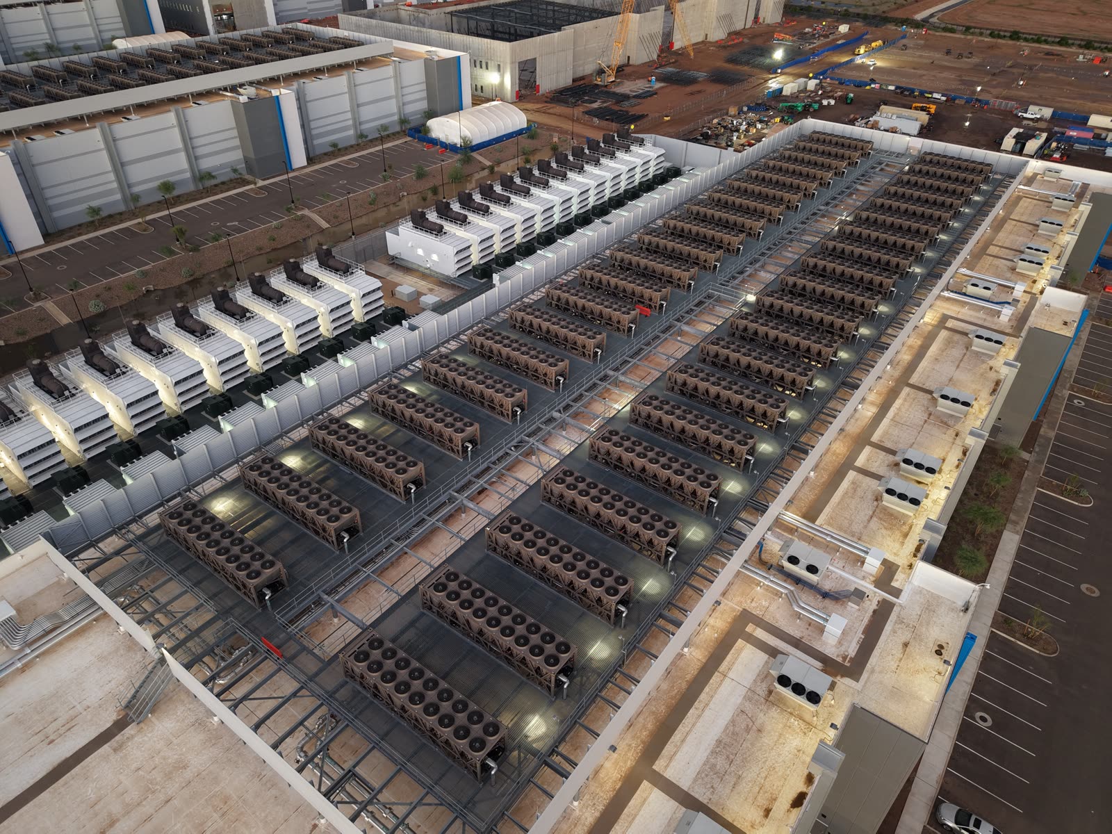 The roof of a data center, covered with cooling units, ductwork and mechanical equipment.