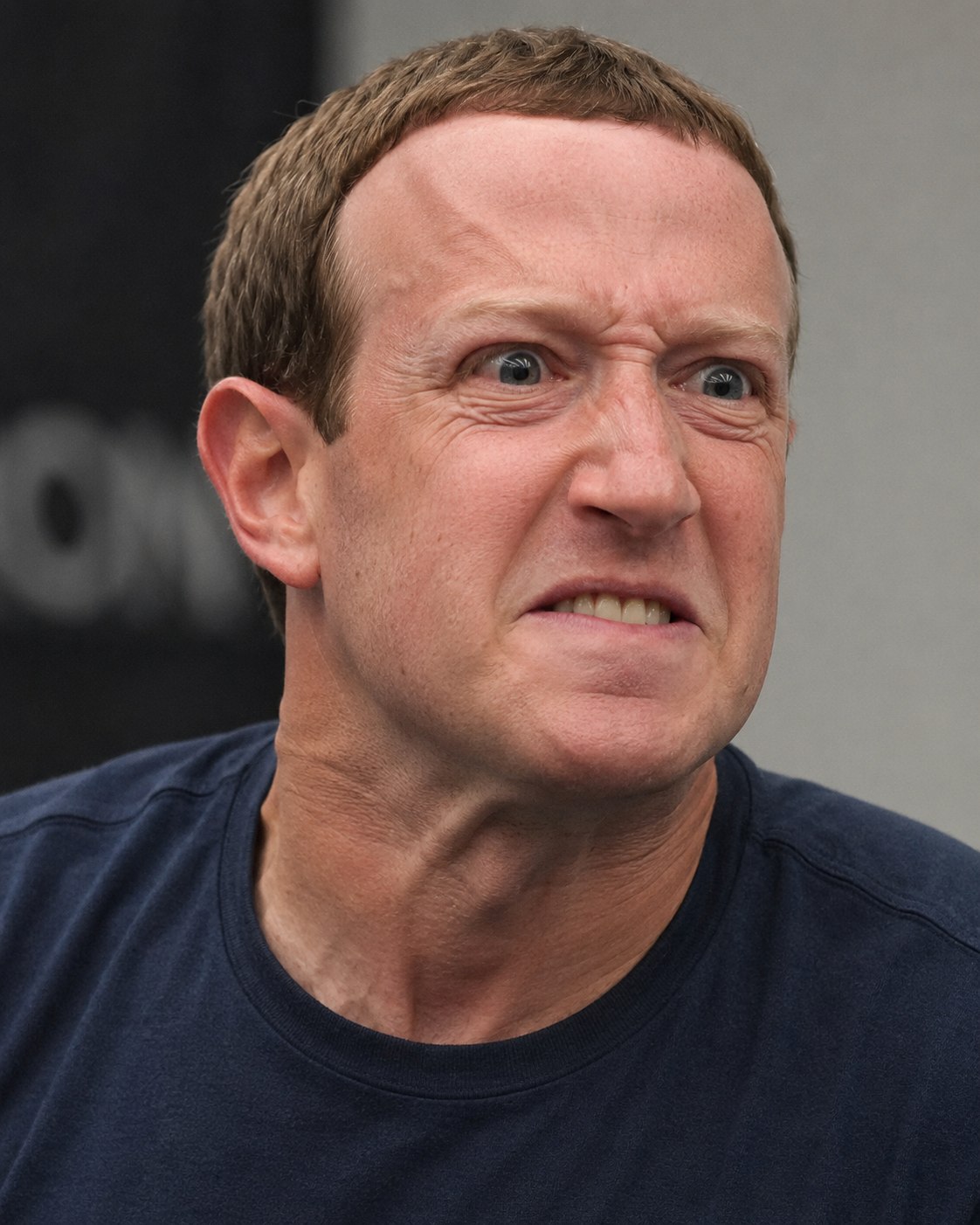 Mark Zuckerberg speaking at a conference in 2008, photographed mid-sentence against a dark background.